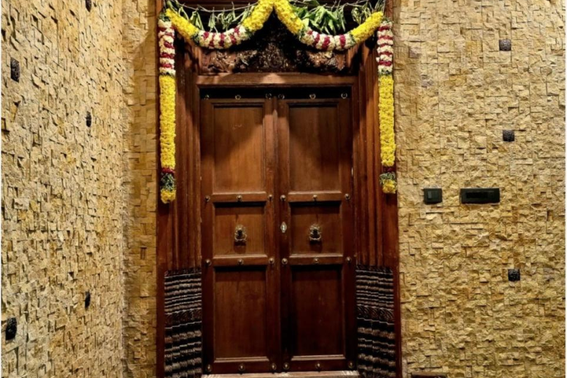 Natural sandstone wall cladding installed on villa exterior in Chennai by Goutham Stones
